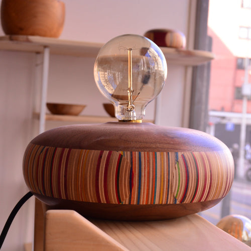 made from recycled skateboard combined with american walnut