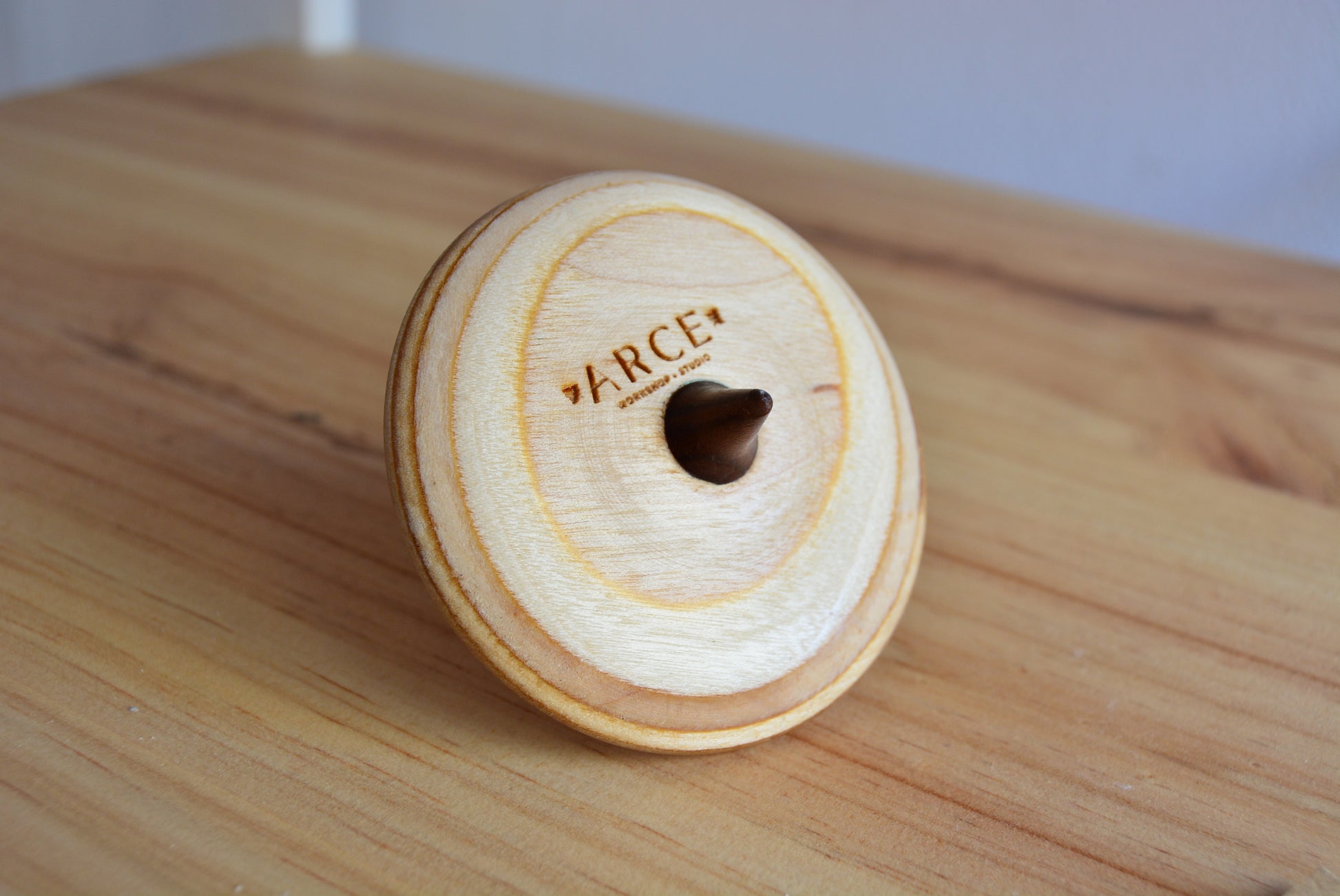 wood spintop made from recycled skateboards and natrual wood